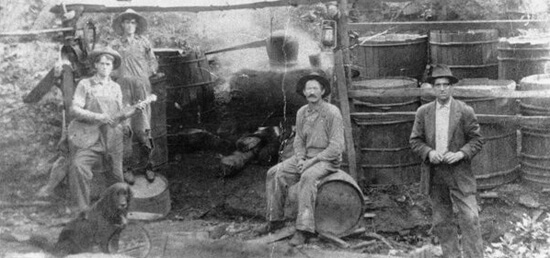 Hosea Thomas' still workers in Endicott, (Franklin County) Virginia, 1915.  The Martin, Rake, and Thomas families trace their origins to Ireland where local residents learned to make liquor (known in Ireland as "potchin") to supplement farm income.  Photo courtesy of the Blue Ridge Institute of Ferrum College.