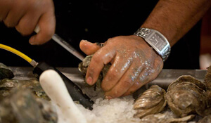 Kelly Yandell, Oyster shucking, Galveston, Texas, 2011.