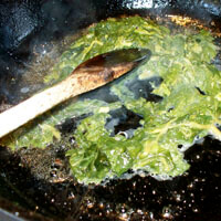 Allison O. Adams, Sauteeing poke in bacon grease, Decatur, Georgia, 2010.