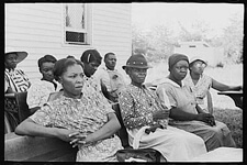 Lee Russell, Audience at Farm Security Administration listening to a speech by a visiting public health official, La Forge, Missouri, 1938. Courtesy of the Library of Congress.