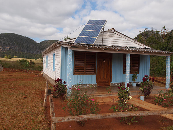 Charles D. Thompson, Jr., Farmhouse fitted with solar collector provided by a grant from the French government. Viñales Valley, Cuba, January 2011.