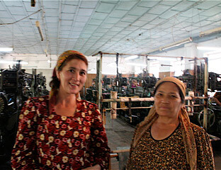 Mary E. Frederickson, Mother and daughter, both workers in the Margilan weave room, Uzbekistan, 2006.