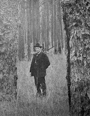 Unidentified lumberman in the Jackson Tract, outside Lockhart, Alabama. American Lumberman 1907, Part 1, January–June 1907, Forest History Society archive.