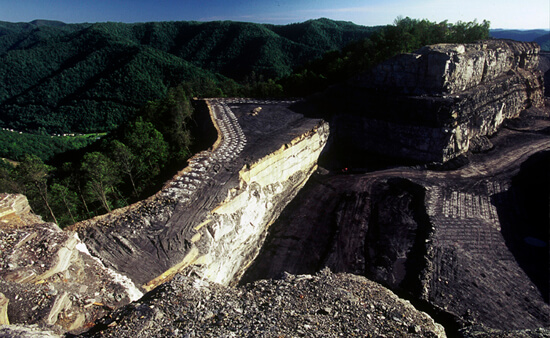 Mark Schmerling, A mountaintop removal site looms over the community of Dorothy, Raleigh County, West Virginia, 2008.