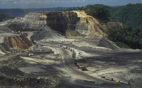 Mark Schmerling, Massive machinery is dwarfed by the size of this mountaintop removal site, Kayford Mountain, Kanawha County, West Virginia, 2006.