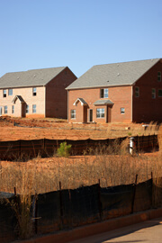 John Howard, Unsold houses amid red clay, Henry County, Georgia, November 2008. John Howard, Unsold houses amid red clay, Henry County, Georgia, November 2008.