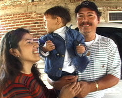 Photograph of Rosa, Miguel and their son. Photograph of Rosa, Miguel and their son.