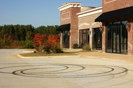 John Howard, Unoccupied commuter mall with stray business cards and ATV tracks, Henry County, Georgia, November 2008. John Howard, Unoccupied commuter mall with stray business cards and ATV tracks, Henry County, Georgia, November 2008.