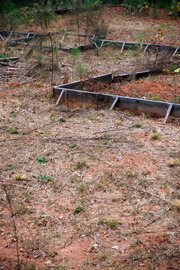 John Howard, Abandoned frame for a concrete slab marks a futile floor plan, Henry County, Georgia, November 2009. John Howard, Abandoned frame for a concrete slab marks a futile floor plan, Henry County, Georgia, November 2009.
