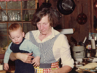 Celestine Sibley and grandson in Sweet Apple kitchen