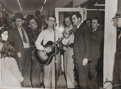 Cas Walker event with Josh Graves (guitar), Monroe Queener (dobro) and crowd Cas Walker event with Josh Graves (guitar), Monroe Queener (dobro) and crowd