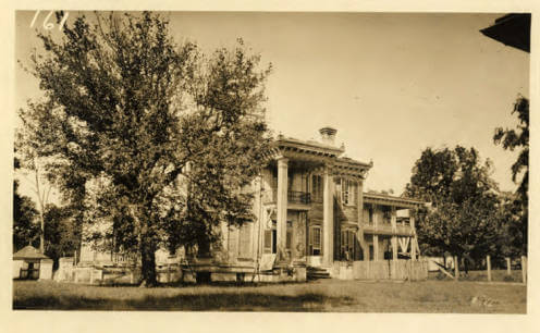 Side view of Malmaison, historic home of Greenwood Leflore, Carroll County, Mississippi, ca. 1923. Photograph by unknown creator. Courtesy of Mississippi State University Libraries, Special Collections Department, University Archives, Cooperative Extension Service Photographs, cdm16631.contentdm.oclc.org/cdm/ref/collection/charm/id/22827. Side view of Malmaison, historic home of Greenwood Leflore, Carroll County, Mississippi, ca. 1923. Photograph by unknown creator. Courtesy of Mississippi State University Libraries, Special Collections Department, University Archives, Cooperative Extension Service Photographs, cdm16631.contentdm.oclc.org/cdm/ref/collection/charm/id/22827.