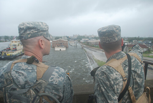 Chuck Simmins, Louisiana National Guardmen observe as water from the industrial canal overtops the levees, New Orleans, Louisiana, September 2008. Chuck Simmins, Louisiana National Guardmen observe as water from the industrial canal overtops the levees, New Orleans, Louisiana, September 2008.