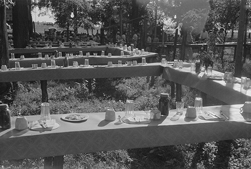 Marion Post Wolcott, Table in picnic grove set for St. Thomas church supper, near Bardstown, Kentucky, August 7, 1940. Library of Congress Prints and Photographs Division, FSA/OWI Black & White Negatives Collection, LC-USF33-030983-M5. Marion Post Wolcott, Table in picnic grove set for St. Thomas church supper, near Bardstown, Kentucky, August 7, 1940. Library of Congress Prints and Photographs Division, FSA/OWI Black & White Negatives Collection, LC-USF33-030983-M5.