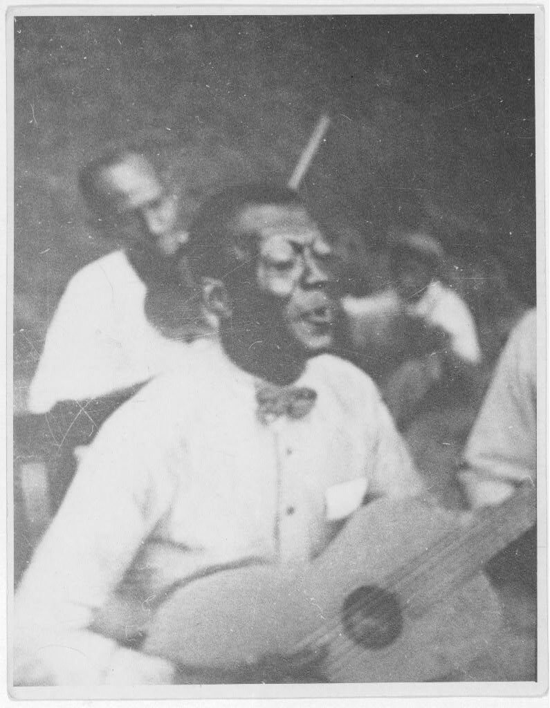 Wilson "Stavin' Chain" Jones playing guitar and singing the ballad "Batson," Lafayette, Louisiana, 1934. Photograph by Alan Lomax. The Lomax Collection, Library of Congress. Courtesy of The Library of Congress, Prints and Photographs Division, LC-DIG-ppmsc-00342. Wilson "Stavin' Chain" Jones playing guitar and singing the ballad "Batson," Lafayette, Louisiana, 1934. Photograph by Alan Lomax. The Lomax Collection, Library of Congress. Courtesy of The Library of Congress, Prints and Photographs Division, LC-DIG-ppmsc-00342.