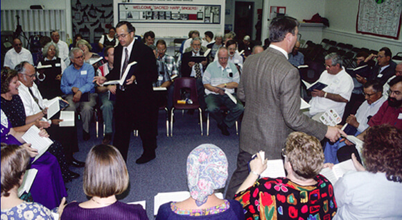 Laurie Sommers, Clarke Lee (left) and David I. Lee walk time at the 2001 All-Day Sing, Hoboken, Georgia. Laurie Sommers, Clarke Lee (left) and David I. Lee walk time at the 2001 All-Day Sing, Hoboken, Georgia.