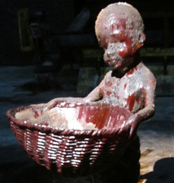 Child carrying basket inside Kara Walker's A Subtlety, Brooklyn, New York, 2014. Photograph by Valérie Loichot. Courtesy of Valérie Loichot.