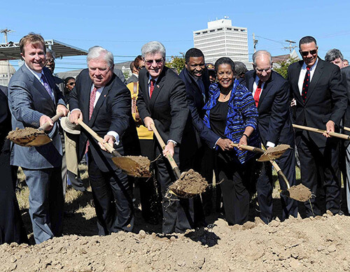 Breaking ground on the Mississippi History and Civil Rights Museums, October 24, 2013. Included in the shovel line, from left, are Entergy Mississippi president Haley Fisackerly, former Governor Haley Barbour, Governor Phil Bryant, state NAACP president Derrick Johnson, former NAACP chair Myrlie Evers, former Governor William Winter, and former state Supreme Court Justice Reuben Anderson. Photograph courtesy of Mississippi Department of Archives and History. Breaking ground on the Mississippi History and Civil Rights Museums, October 24, 2013. Included in the shovel line, from left, are Entergy Mississippi president Haley Fisackerly, former Governor Haley Barbour, Governor Phil Bryant, state NAACP president Derrick Johnson, former NAACP chair Myrlie Evers, former Governor William Winter, and former state Supreme Court Justice Reuben Anderson. Photograph courtesy of Mississippi Department of Archives and History.