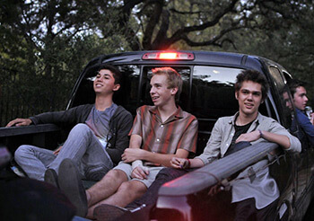 Mason Jr. (Ellar Coltrane) hangs out with friends in a truck bed, 2014. © IFC Films. Mason Jr. (Ellar Coltrane) hangs out with friends in a truck bed, 2014. © IFC Films.