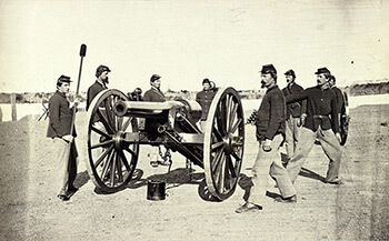 A twenty-pound Parrott Gun and its crew at Fort Richardson, Arlington Heights, Virginia, 1861–1865. The De Gress Battery was comprised of four rifled cannon of this type. Albumen print, ca. 1865.