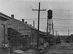 St. Thomas Street: the before photo. View shows street view prior to the demolition that cleared the area for the St. Thomas Housing Project. New Orleans, Louisiana, circa 1939. Photograph by US Housing Authority. National Archives and Records Administration, 196086.