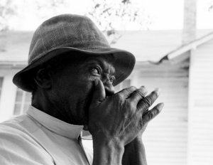 Golden Bailey playing the harmonica.