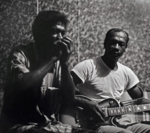 Jimmy Lee and Eddie Harris playing the harmonica and guitar.