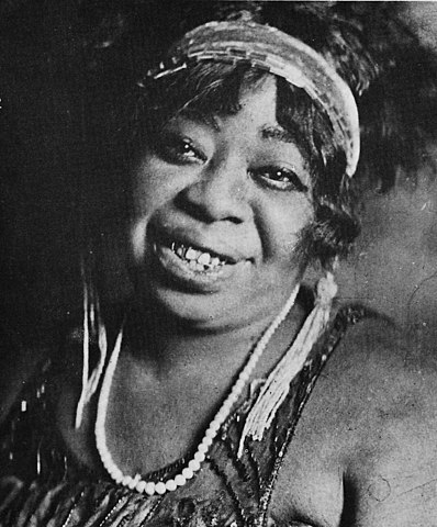 Gertrude Pridget "Ma" Rainey smiling at the camera.