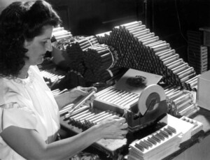 Mirta Perez seals tube to retain cigar's seasoned flavor, Tampa, Florida, November 24, 1947. Photographer unknown.