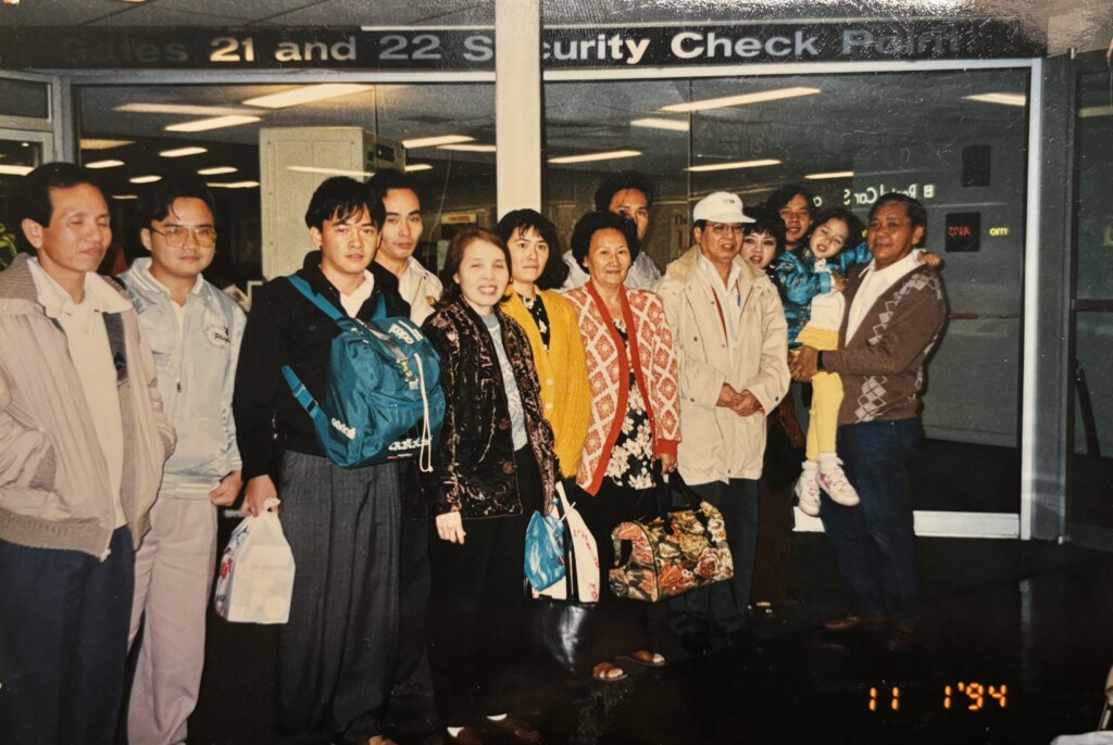 The Đỗ family reunites at the Baltimore airport security checkpoint in November 1994.