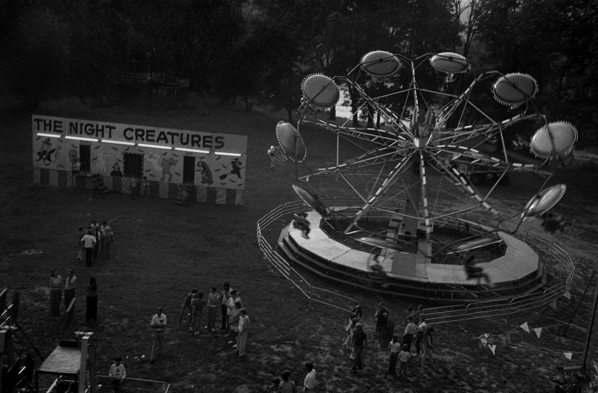 County carnival showing a spinning ride.