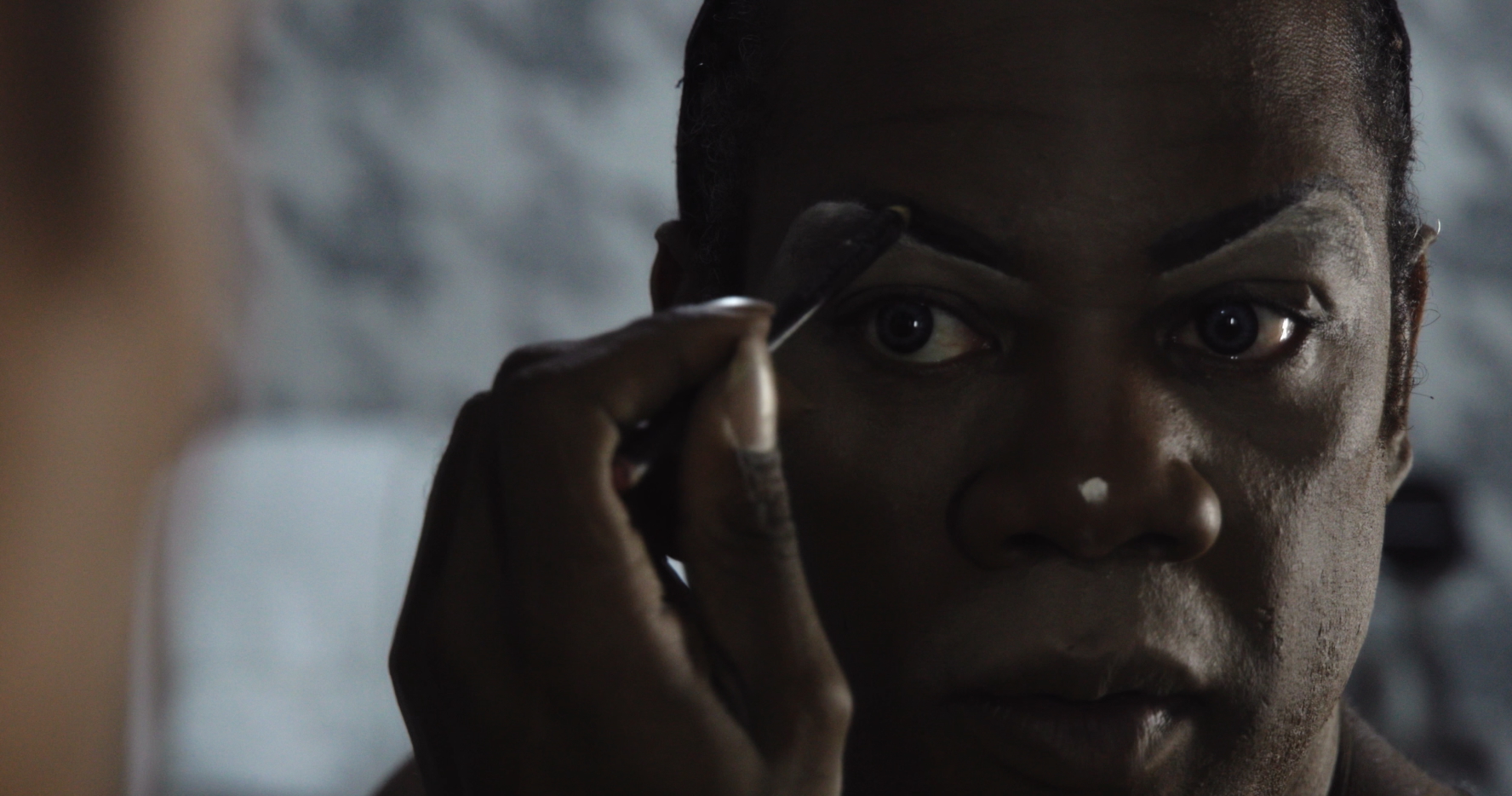 Victorial applying makeup.